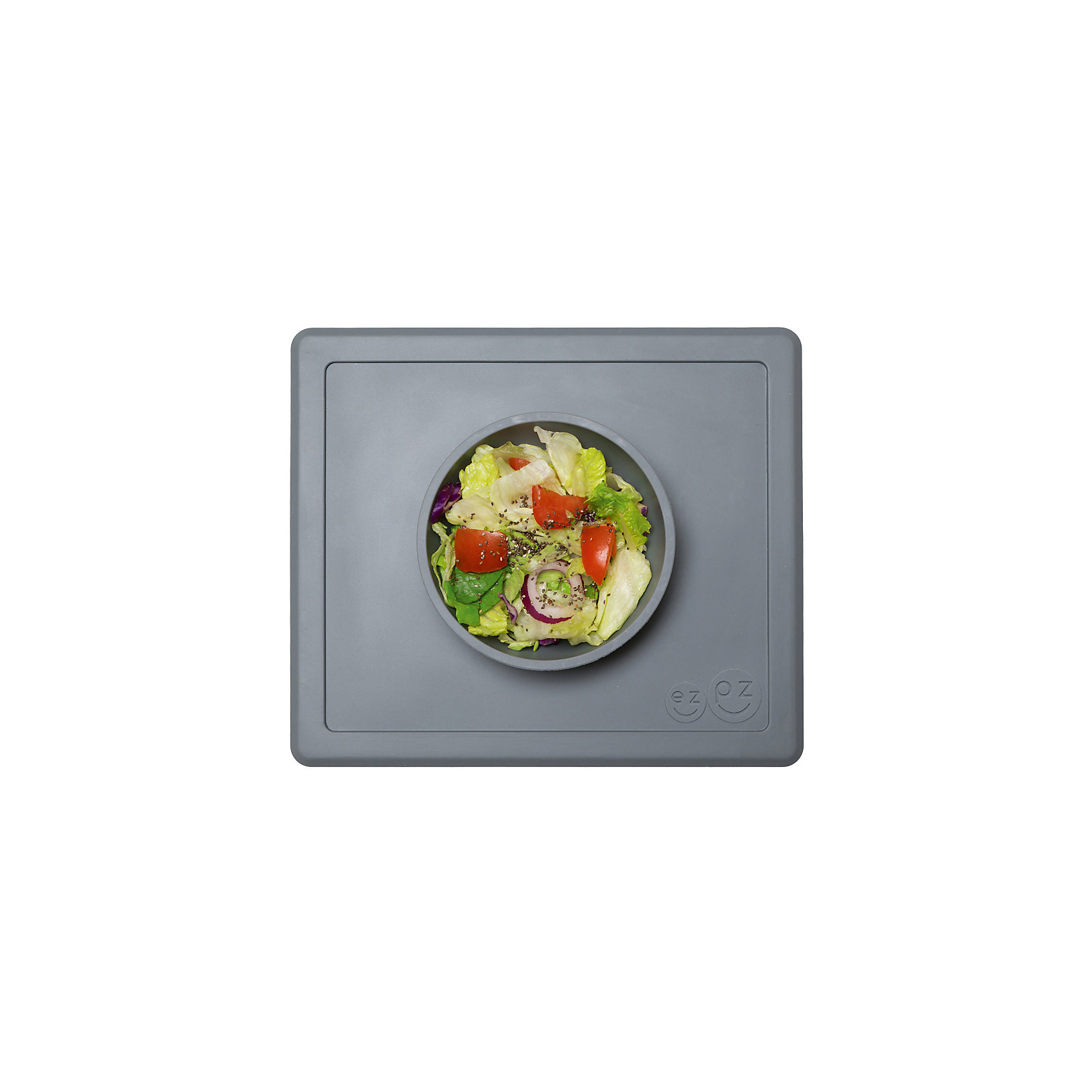 Тарелка глубокая с подставкой Happy Bowl, 240 мл., ezpz, серый Тарелка глубокая с подставкой Happy Bowl, 240 мл., ezpz, серыйПосуда для малышей<br>Тарелка с подставкой Happy Bowl, ezpz, серый.<br><br>Характеристики:<br>• изготовлена из качественного пищевого силикона<br>• не содержит бисфенол, свинец, фталаты и ПВХ<br>• надежно прикрепляется к столу<br>• не имеет присосок<br>• сгибается по краям<br>• подходит для использования в посудомоечной машине и микроволновой печи<br>• состав: 100% силикон<br>• размер: 26,5х22,5х3,5 см<br>• объем: 240 мл<br>• цвет: серый<br><br>Тарелка с подставкой Happy Bowl, ezpz отлично подойдет для детей, которые только учатся есть аккуратно. Вы можете налить ребенку суп в чашу и не бояться, что малыш прольет его, ведь тарелка надежно крепится к столу за счет своего веса. По краям мата вы сможете положить хлеб, чашку или столовые приборы. Тарелку можно греть в микроволновой печи и мыть в посудомоечной машине, что еще больше облегчает ее использование. <br><br>Тарелку с подставкой Happy Bowl, ezpz, серый можно приобрести в нашем интернет-магазине.<br><br>Ширина мм: 260<br>Глубина мм: 35<br>Высота мм: 225<br>Вес г: 460<br>Возраст от месяцев: 0<br>Возраст до месяцев: 36<br>Пол: Унисекс<br>Возраст: Детский<br>SKU: 5068708